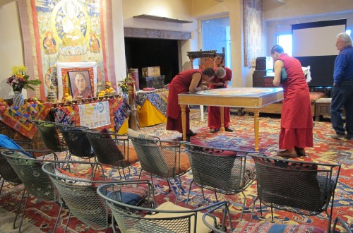 Monks of the Yellow Hat Geluk school of Tibetan Buddhism create a sand paining in Santa Fe, New Mexico. Photo by Barbara Newhall