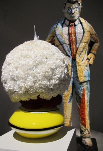 Round floral arrangement of white carnations by Ricardo Aguilar of VelaFlor, San Francisco. ceramic sculpture by Viola Frey, "Man Observing Series II" 1984. Photo by Barbara Newhall