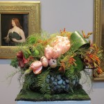 Floral design at the FAMSA Bouquets to Art exhibition 2015 by Andrea Frenkel of Ukiah, CA. Lily and Mint. the design complements George DF Brush's 1890 painting "A Celtic Huntress." Photo by Barbara Newhall