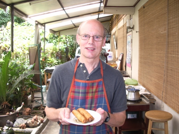Jon Newhall takes a class in Thai cooking in Bangkok and shows off his dish. Photo by Jon Newhall