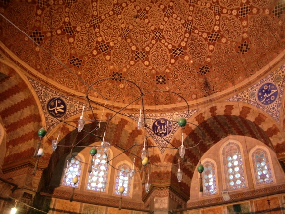 Ceiling and arched windows of a mosque in Instanbul, with hanging lights. Does Islam scare you? Photo by Barbara Newhall