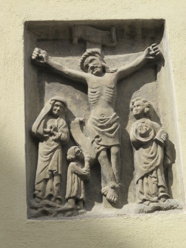 This stone imae of the crucifixion, of Jesus on the cross is on the outside of the University of Bamberg auditorium. Aula. Photo by Barbara Newhall