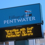 The Pentwater Michigan marquee announces book talk by Barbara Falconer Newhall on her book, Wrestling with God. Photo by Barbara Newhall
