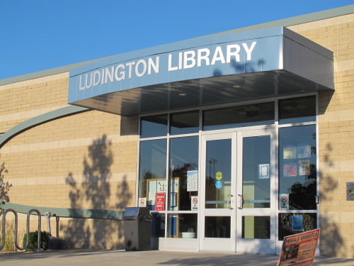The sleek, modern rear entrance to the Ludington, MIchigan, library contrasts with its formal facade facing the main street. Photo by Barbara Newhall. Barbara Falconer Newhall travels up and down Michigan's lower peninsula, visiting friends and family and putting on book events for "Wrestling with God."