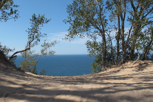 View of Lake MIchigan through trees atop a dune at Sleeping Bear Dunes National Lakeshore. Photo by Barbara Newhall. Barbara Falconer Newhall travels up and down Michigan's lower peninsula, visiting friends and family and putting on book events for "Wrestling with God."