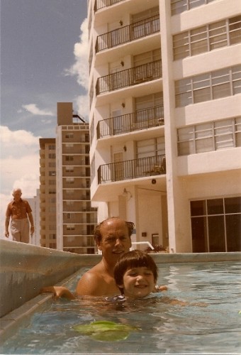 Father and 4-year-old son in a condominium swimming pool not designed for children in Miami Beach in 1985 with Atlantic in the background. Photo by Barbara Newhall