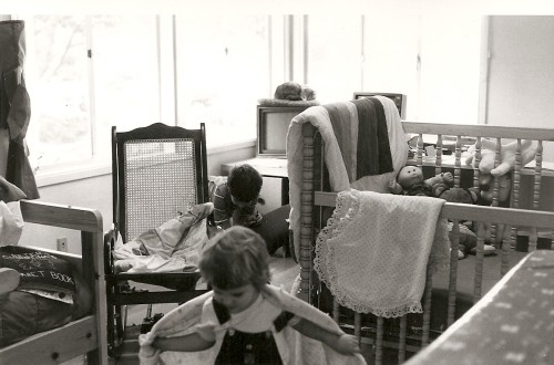 A 1986 home office with computer, crib, toddler and cat. Photo by Barbara Newhall