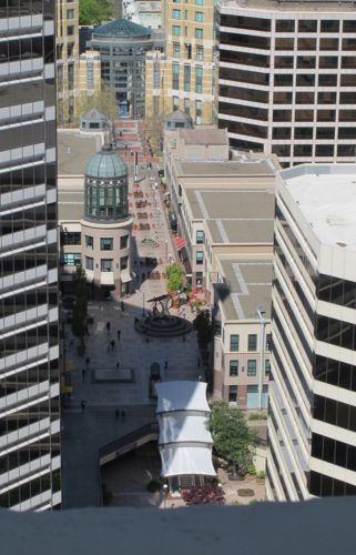April 4, 2016. Photo by Barbara Newhall. Looking NW from the Oakland, CA, Tribune Tower into Oakland City Center Walk. Clorox company building at left, Citibank to the right.