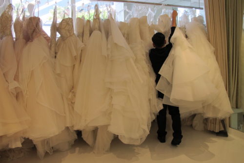 A rack of gowns poofy enough to fill a queen-sized comforter on sale at Le Marriage bridal salon in Los Angeles. Wedding dress shopping. Photo by Barbara Newhall
