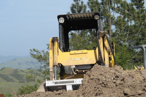 An earth mover at work on a construction site, analogous to rebuilding a mobile friendly website. Photo by Barbara Newhall