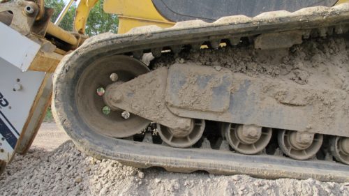 tractor wheels at a construction site -- like the messy, heavy work of updating a website to mobile friendly. Photo by Barbara Newhall
