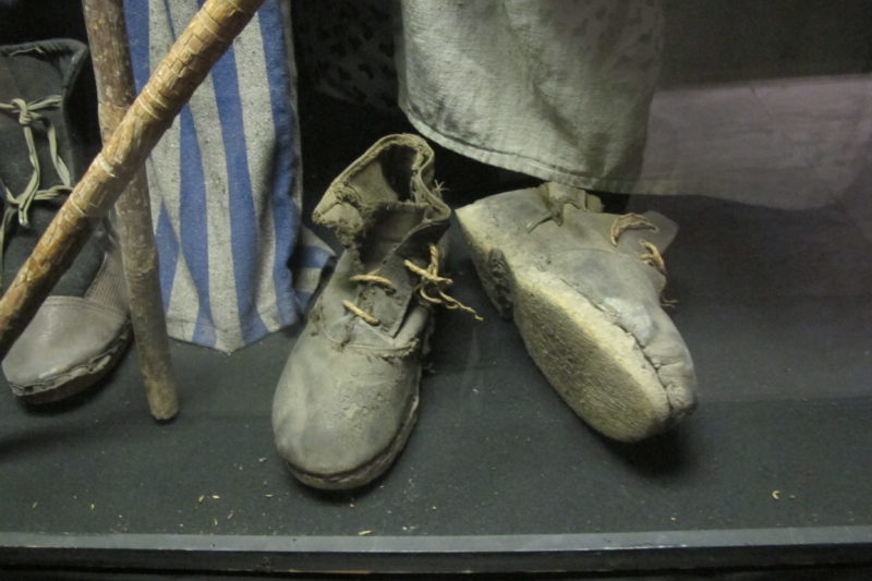 Ernie Hollander: Shoes and clothing worn by prisoners at Nazi concentration camps during World War II. Photo by Barbara Newhall