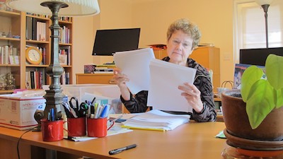 Barbara Falconer Newhall at her home office desk getting ready to do final edits on her book, "Wrestling with God." Photo by Barbara Newhall
