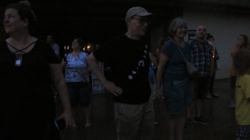 A totality disappointment: Eclipse chasers in deep darkness during total sun eclipse in St. Joseph, MO, August, 2017. Photo by Barbara Newhall