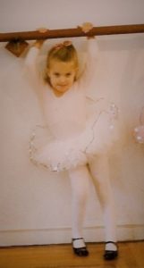 Preschooler at the barre, she loved feminine pink, but did not grow up to find spike heels feminine. Photo by Barbara Newhall