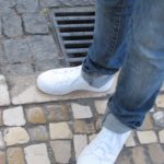White sneakers with tight jeans on the cobblestoned streets of Lisbon's Baixa shopping district. Photo by Barbara Newhall