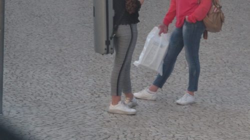 Lisbon girls wearing white sneakers with tight leggings and bare ankles. Photo by Barbara Newhall