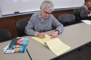 Author Barbara Falconer Newhall gets some writing done in a quiet classroom at St. Mary's College during the Bridgeingwriters retreat held June 9. Barbara Newhall photo