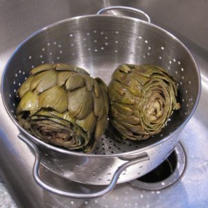 Jon Newhall makes dinner, this one includes artichokes. Photo by Barbara Newhall