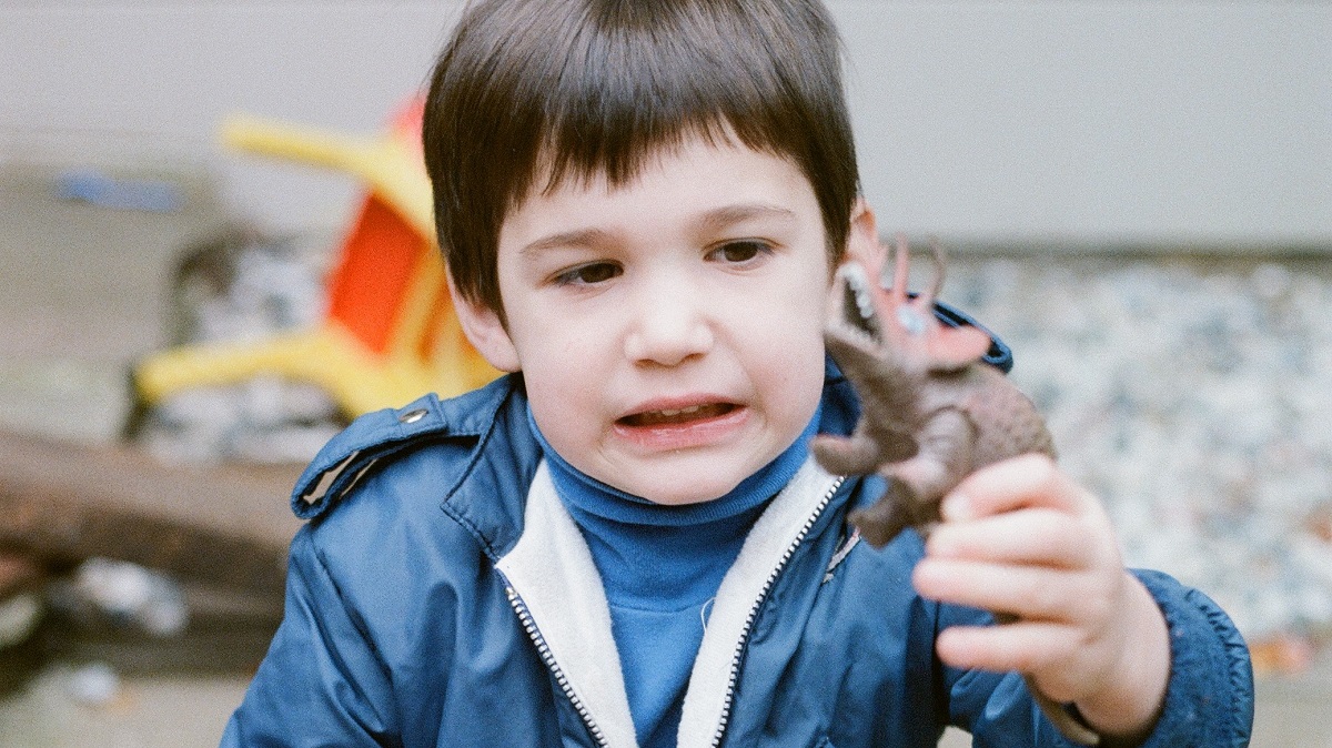 boy-with-toy-dinosaur